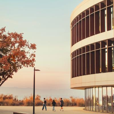 Students walking past LMU library towards the bluff